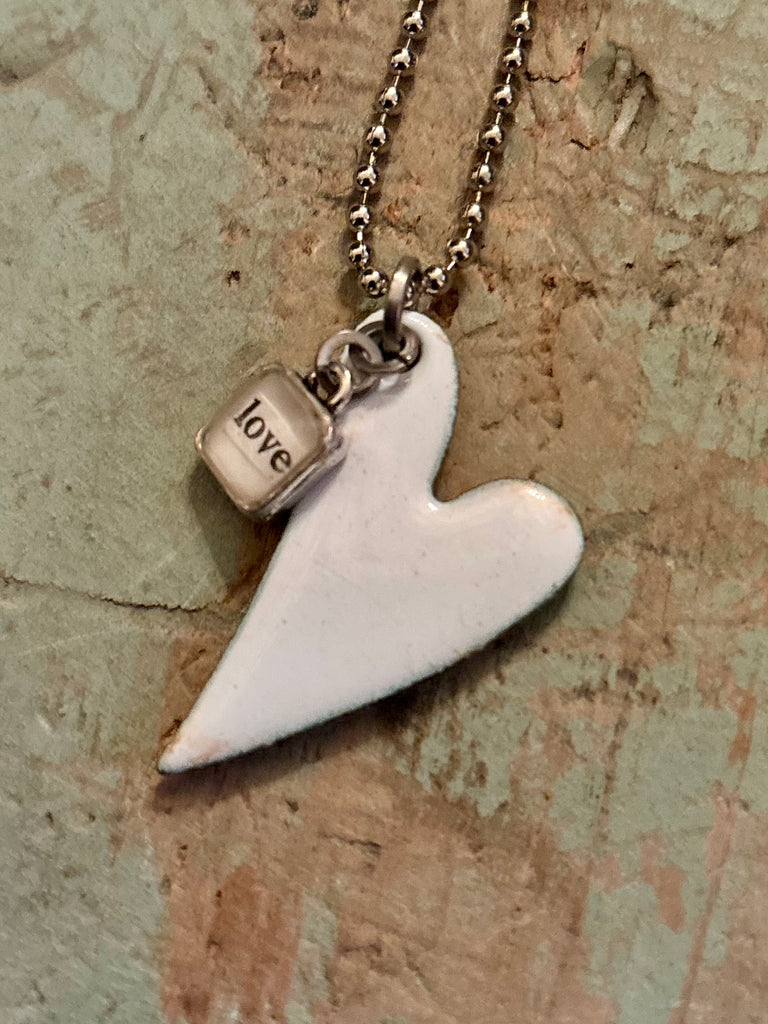 white enameled “love” heart”